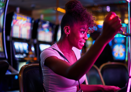 photo of woman at casino on a slot machine